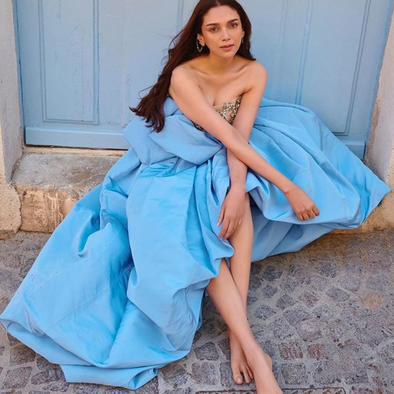 Aditi Rao's French glamor is emerging in the blue gown.  This look of Aditi is from Cannes Festival.  Her minimal accessories complement the look.  The actress wore subtle makeup.