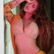Photo by Shama Sikander on August May be an image of person makeup hair and bra