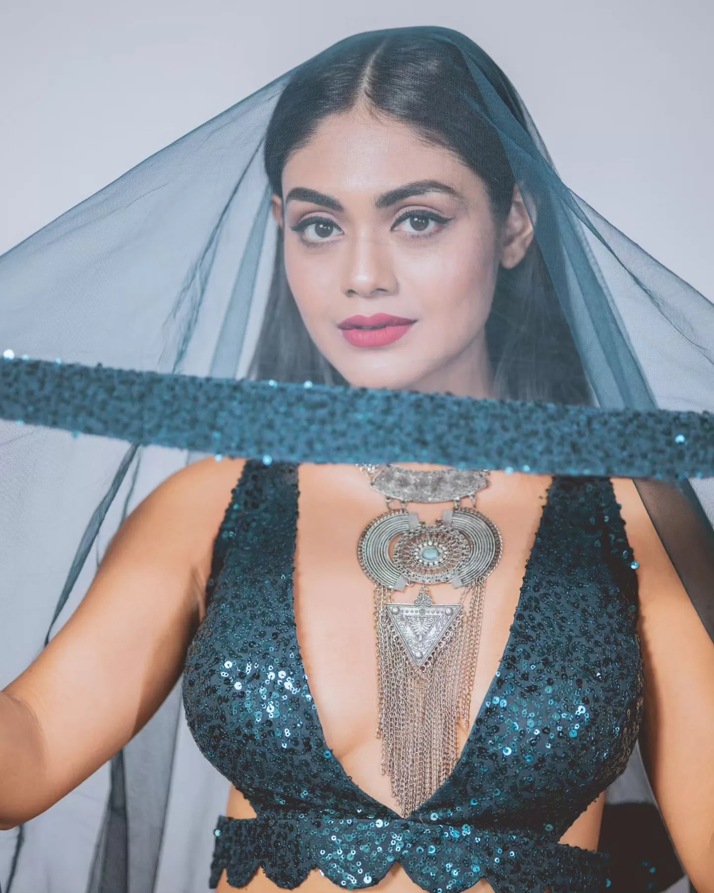 Photo by Sreejita De Blohm Pape on August 02 2023. May be an image of 1 person makeup jewelry dress and halter top jpg