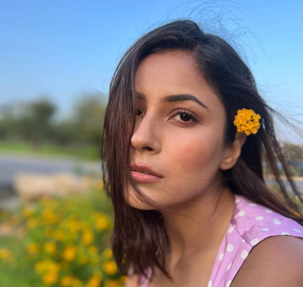 Photo by Shehnaaz Gill on June May be a closeup of one or more people makeup and flower